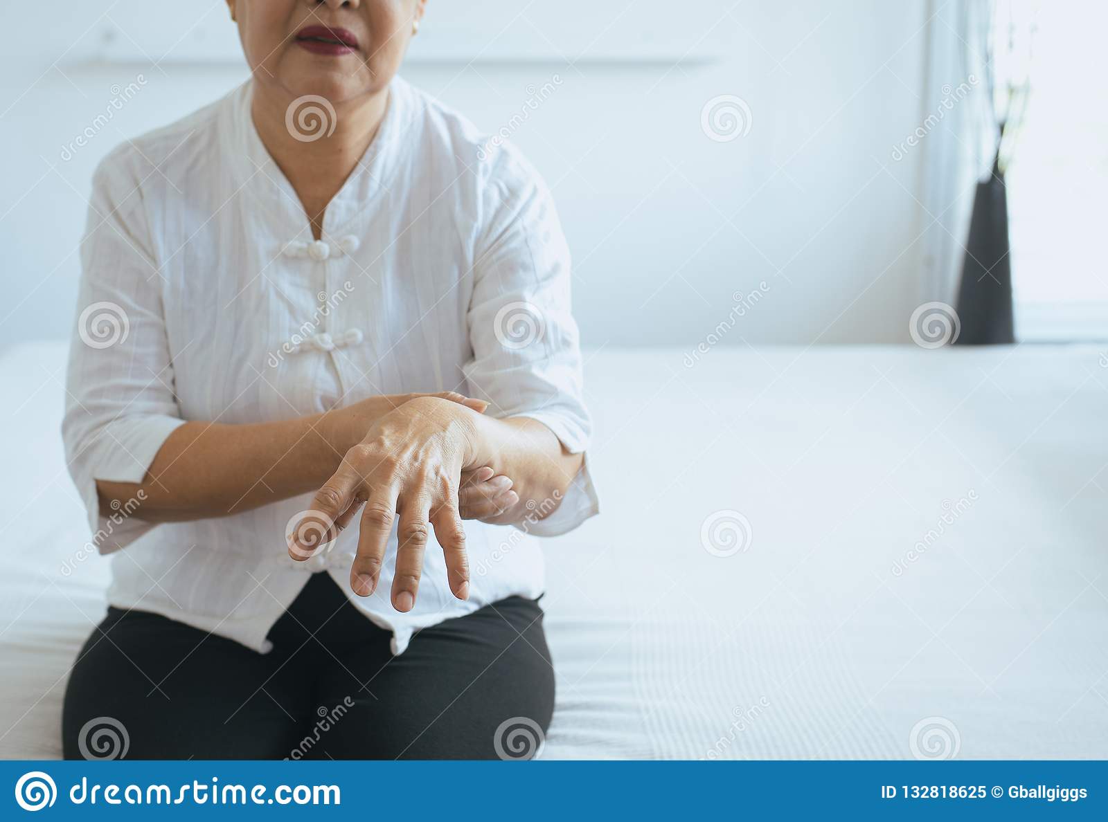 Elderly Woman Suffering With Parkinson`s Disease Symptoms ...